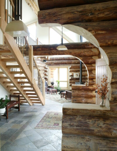 A log home interior with stairs